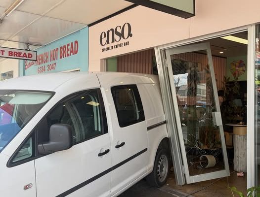 Van reversed into coffeesshop doors