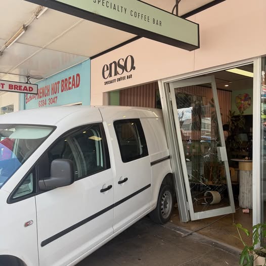 Van reversed into coffeesshop doors
